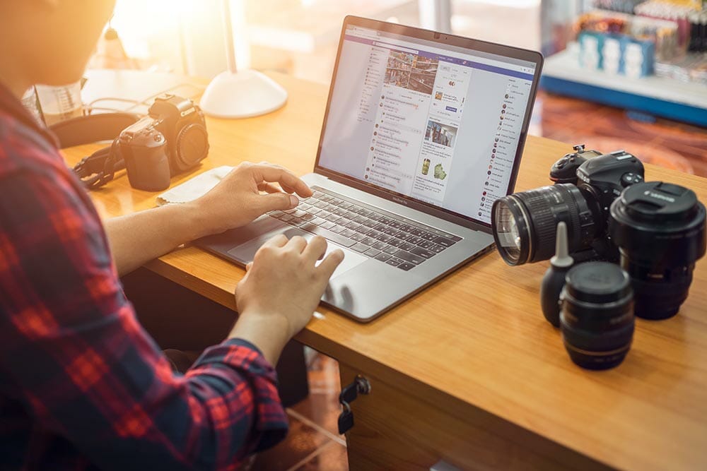 August 8, 2011 in Bangkok, Thailand A young man takes a photo shoot on Facebook to sell online products and to increase sales and sales channels in the future.