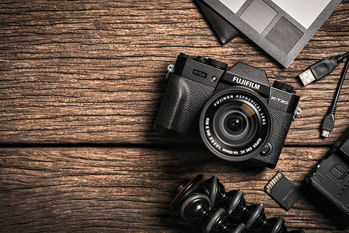 Fuji mirrorless camera on a wooden table looking down on to camera
