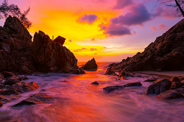 Long exposure image of Dramatic sky seascape with rock in sunset scenery background Amazing light nature landscape.