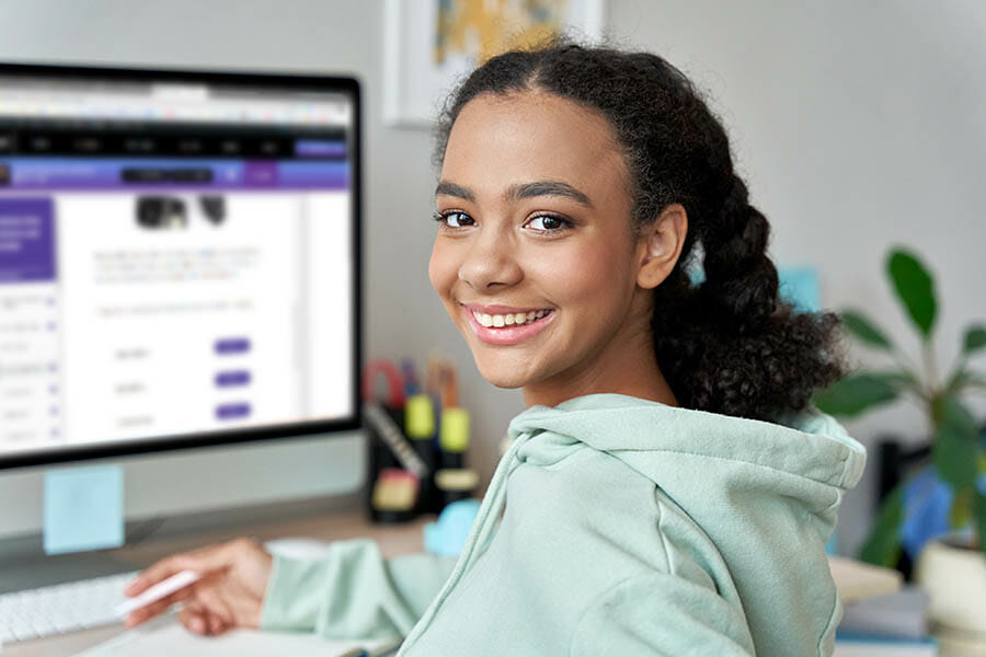 Teenage mixed race girl high school student distance e learning group online class at home looking at camera. Video conference call remote class, course, virtual digital education, headshot portrait.