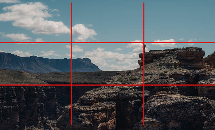 rule of thirds example a man standing on a cliff