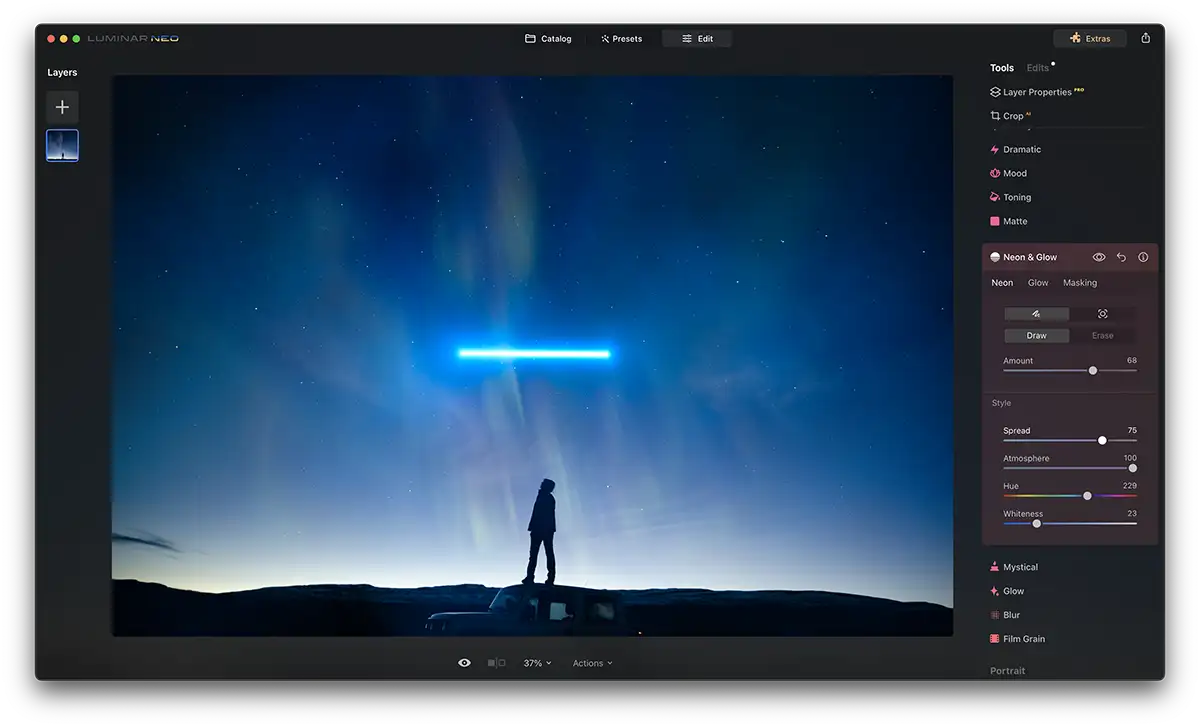 Screenshot of Luminar Neo Neon Glow Effect with a blue glowing bar above a person stood on a car roof at night time. Stars are in the sky.