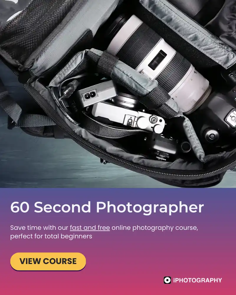 a top down view of a camera bag open with lenses and camera on show