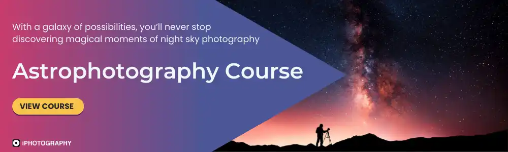 a silhouette of a person with a camera on a tripod taking photos of the night sky milky way