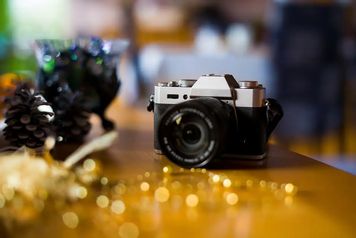 Camera by fairy lights