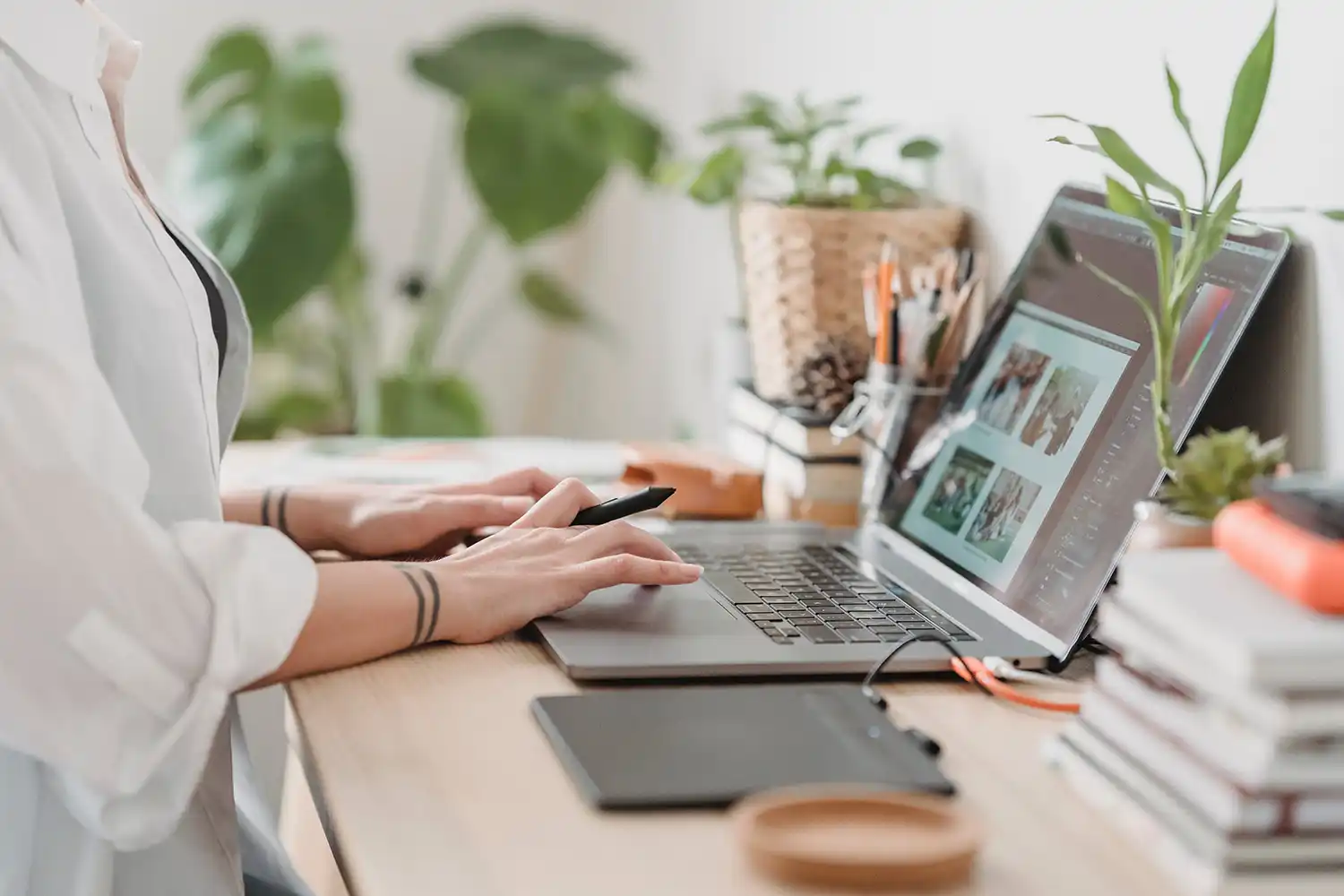 a ladies hands on a laptop keyboard