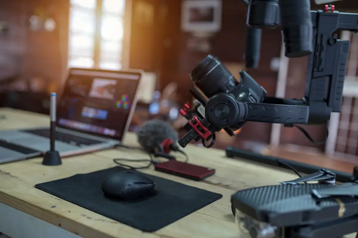 Desk with Vlogging equipment camera, microphone and laptop