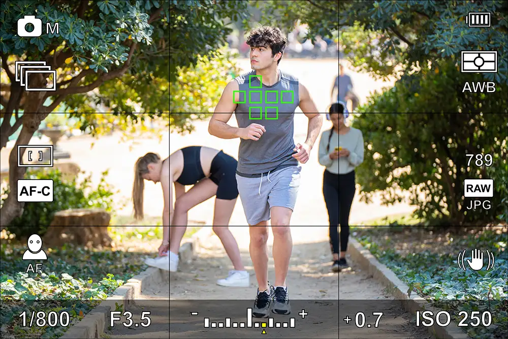 man running through camera screen