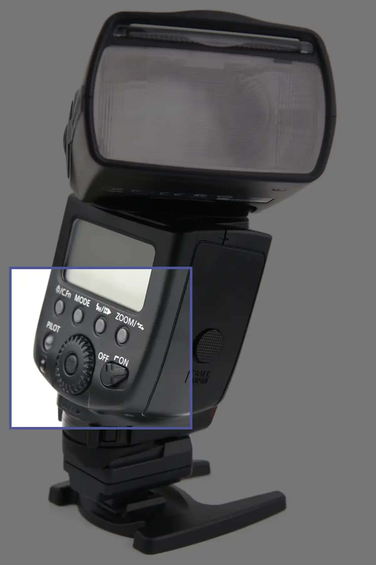 Close up of buttons on the back of a camera flash