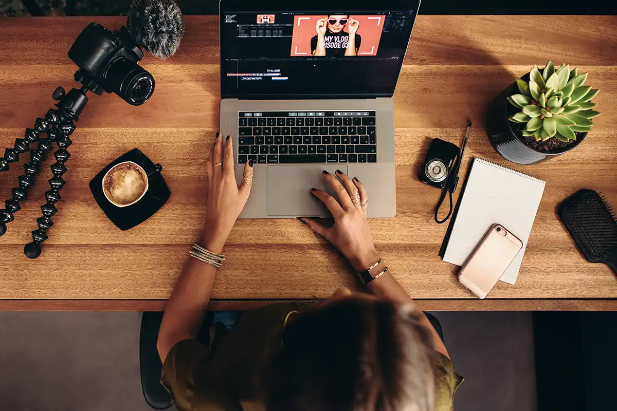Overhead of laptop and vlogging equipment