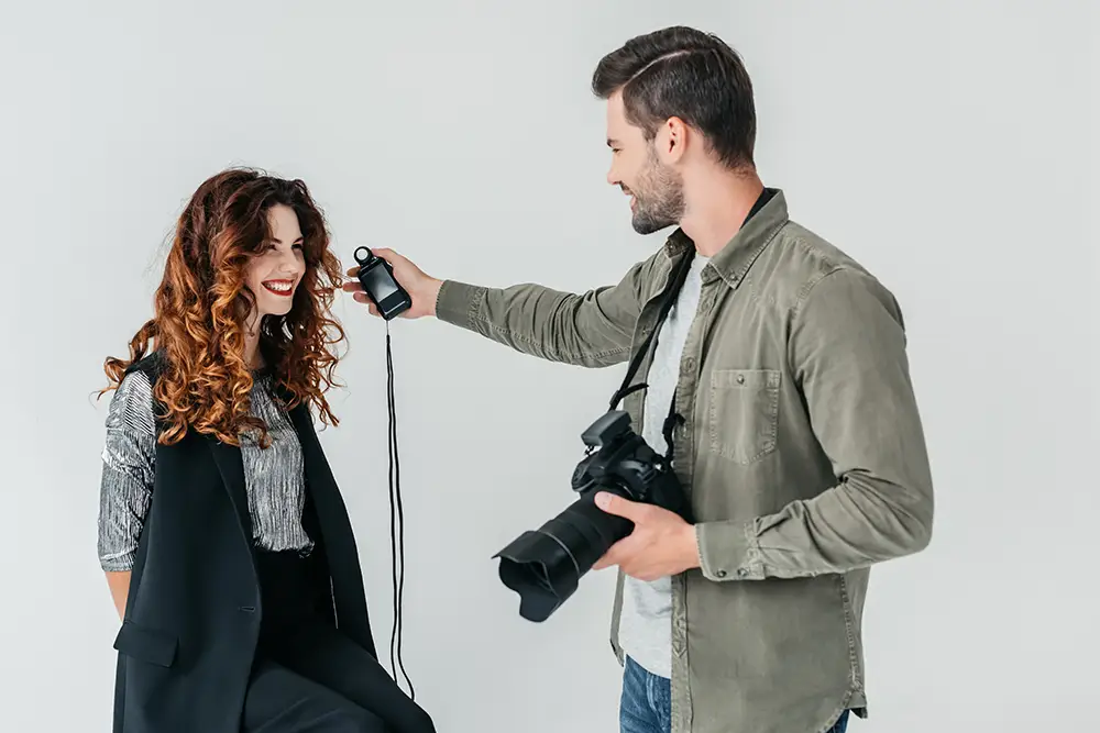 Photographer Using a Light Meter
