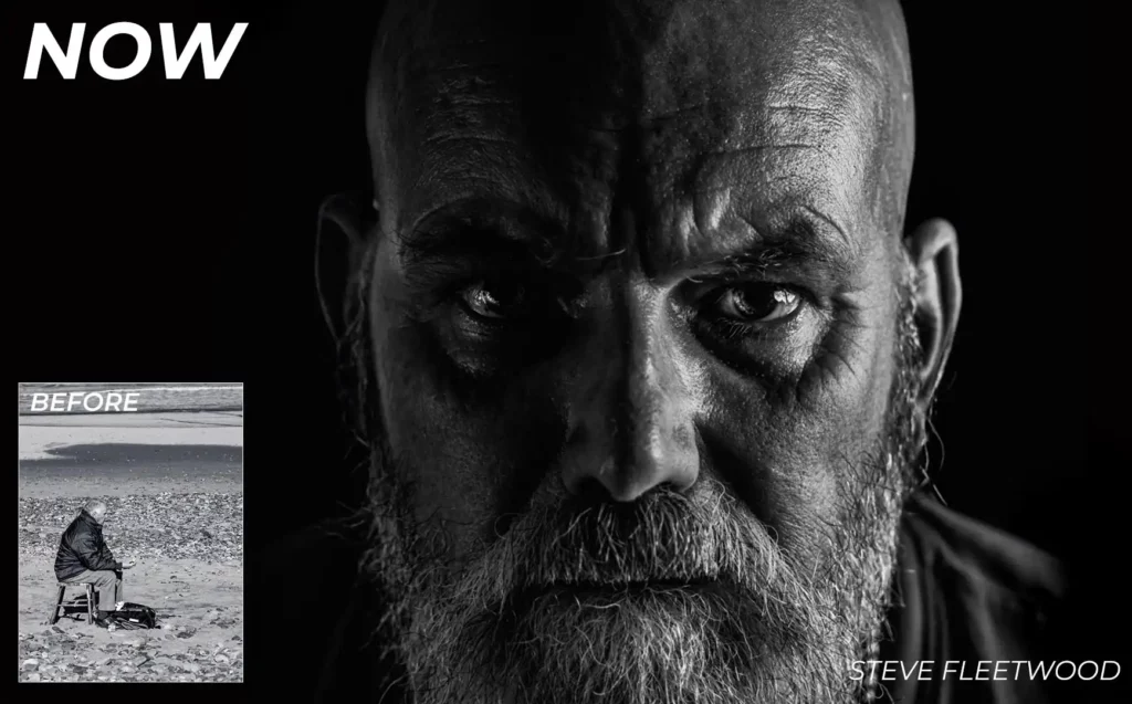 a black and white photo of a bald man with a white beard in a dark room