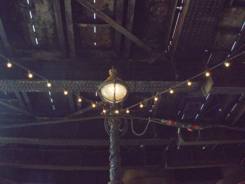 photo of an old London victorian lamp with string lights