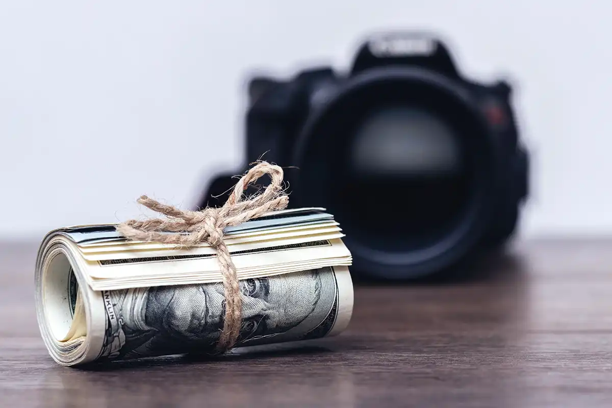 Roll of money in front of a camera