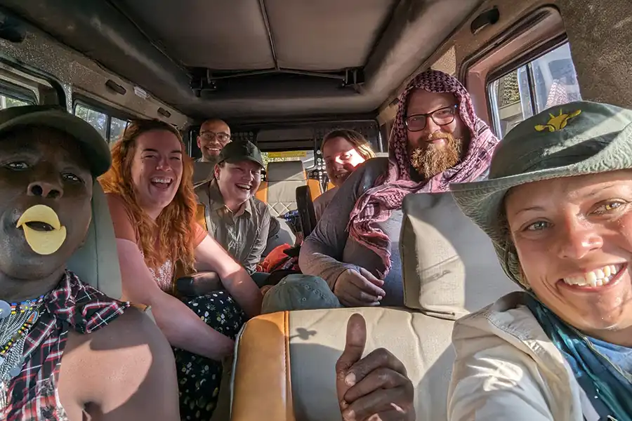 a group of photographers in a game drive jeep on safari in Kenya