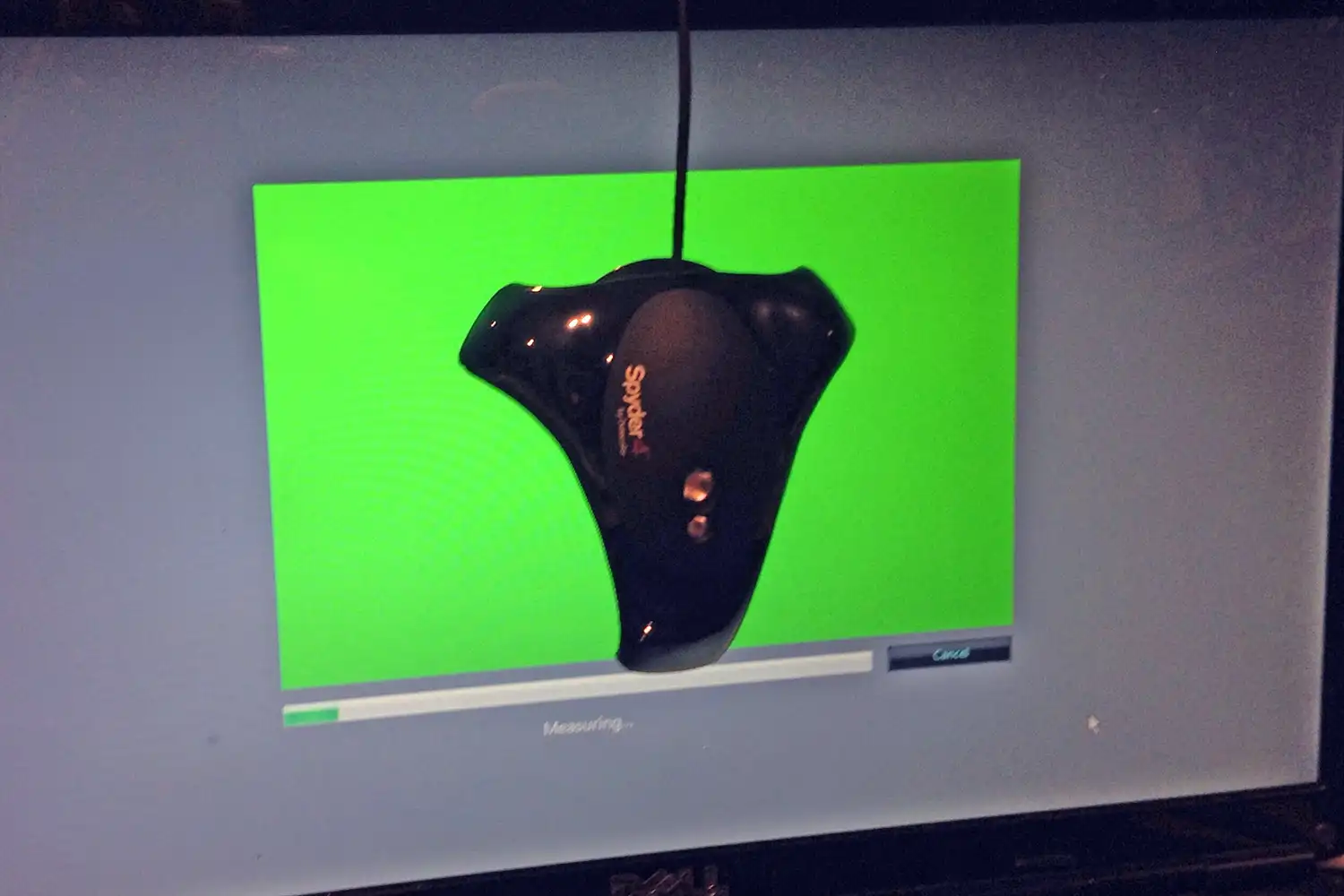 Spyder4Elite over a computer monitor calibrating the colours