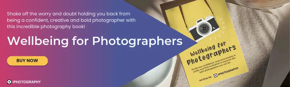wellbeing for photographers book by iPhotography on a table next to a cup of coffee