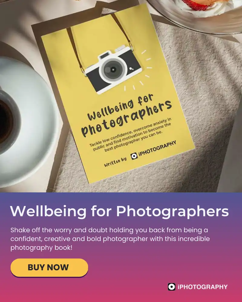 wellbeing for photographers book by iPhotography on a table next to a cup of coffee